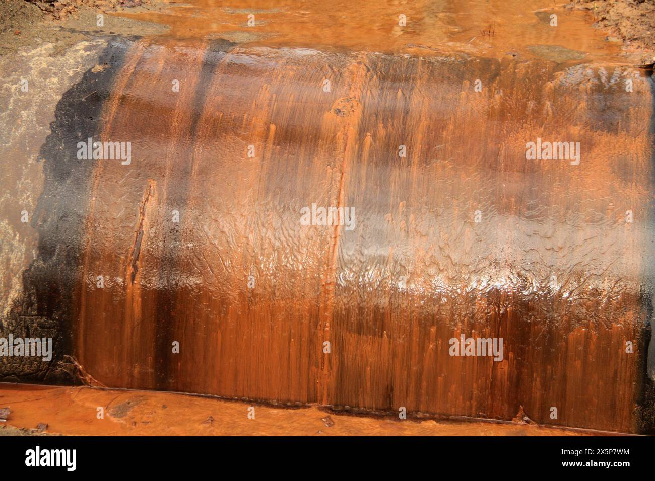 Dirty surface water mixed with eroded soil near a construction site Stock Photo