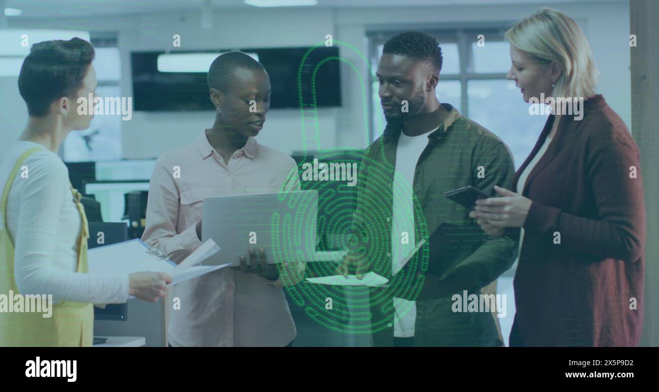 Diverse team discussing over digital interface in office Stock Photo