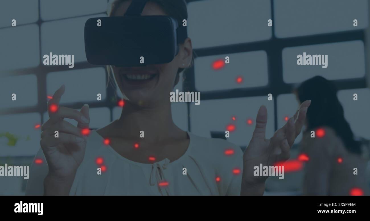 Caucasian woman in VR headset using digital interface Stock Photo