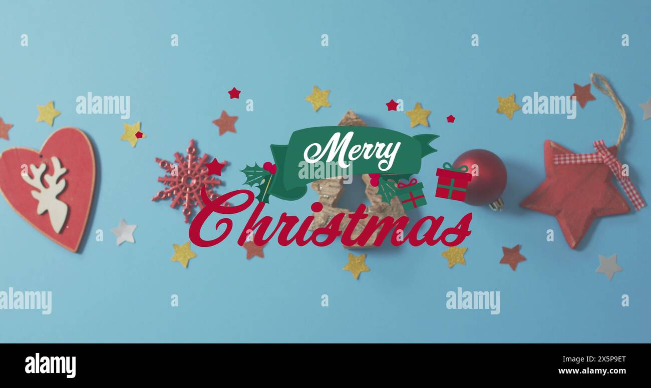 Various Christmas decorations are scattered on blue background Stock Photo