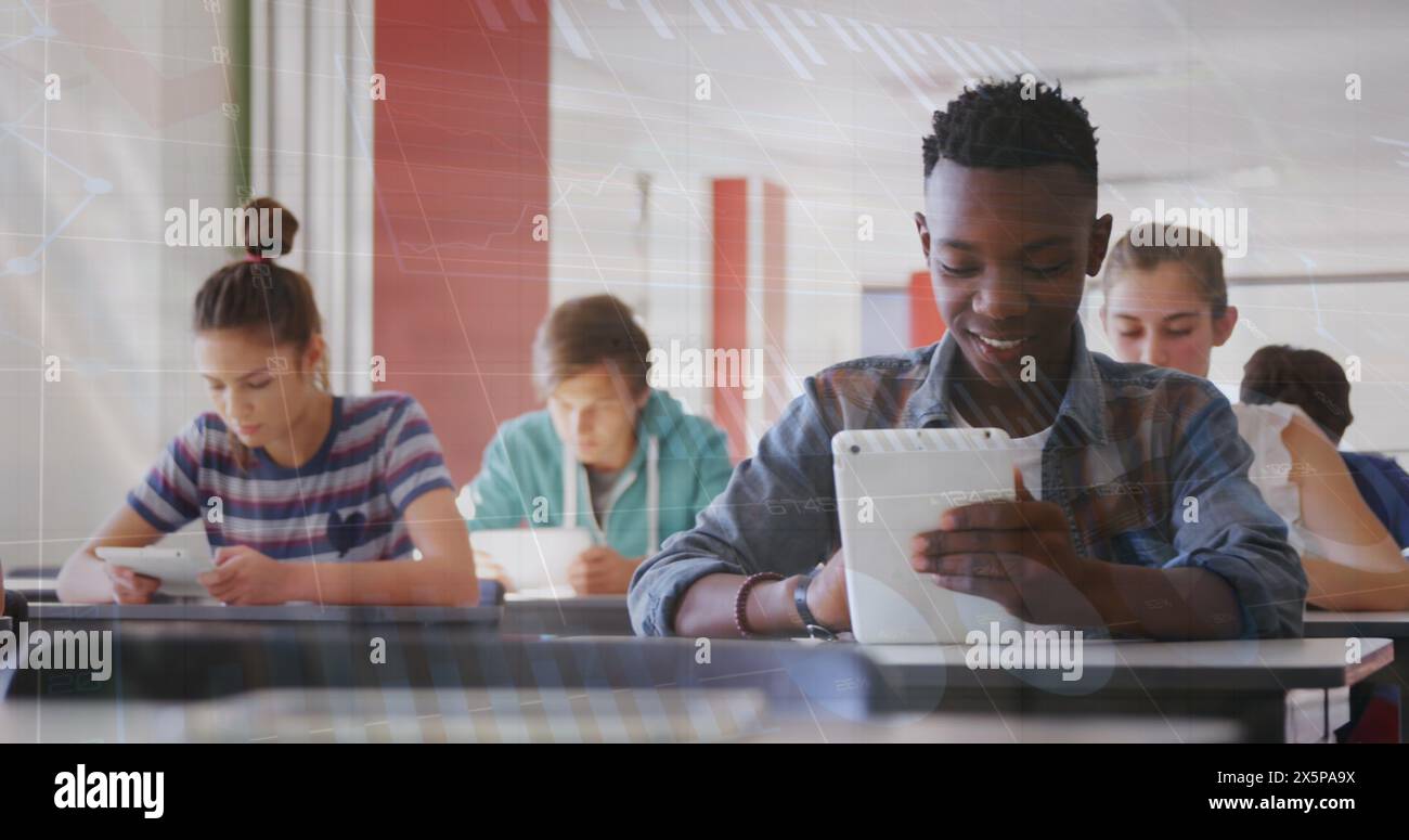 Image of statistical data processing over african american boy using digital tablet at school Stock Photo