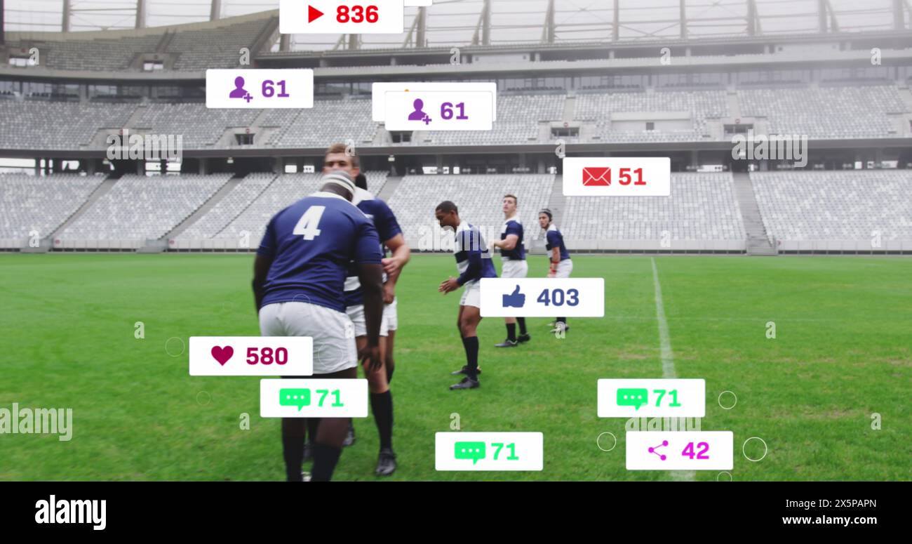Image of social media icons foating against team of diverse rugby players playing in the stadium Stock Photo