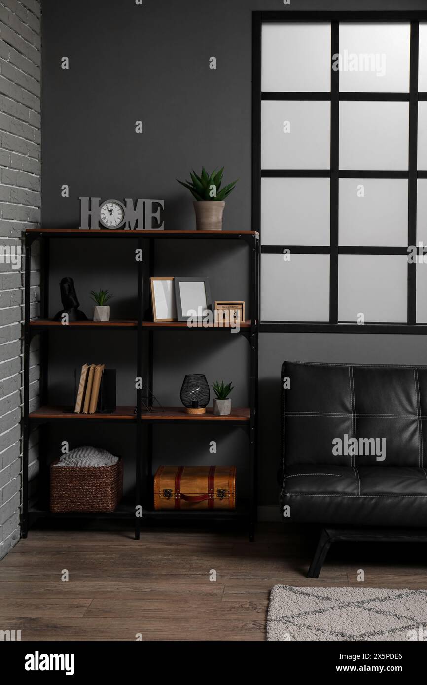 Stylish interior of modern living room with black sofa Stock Photo - Alamy
