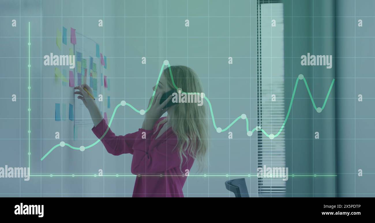 Image of financial data processing over businessman using tablet Stock Photo