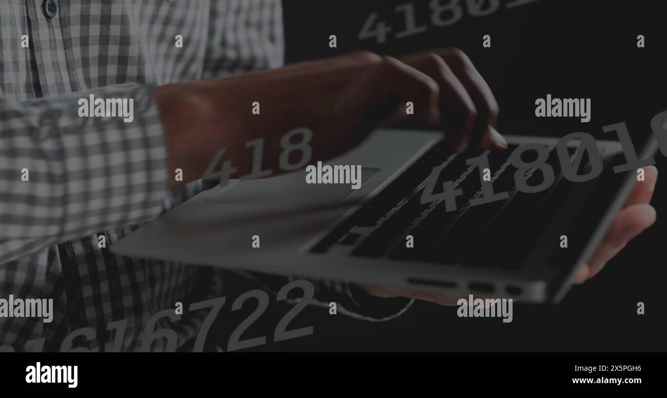 Image of data processing over hands using laptop Stock Photo