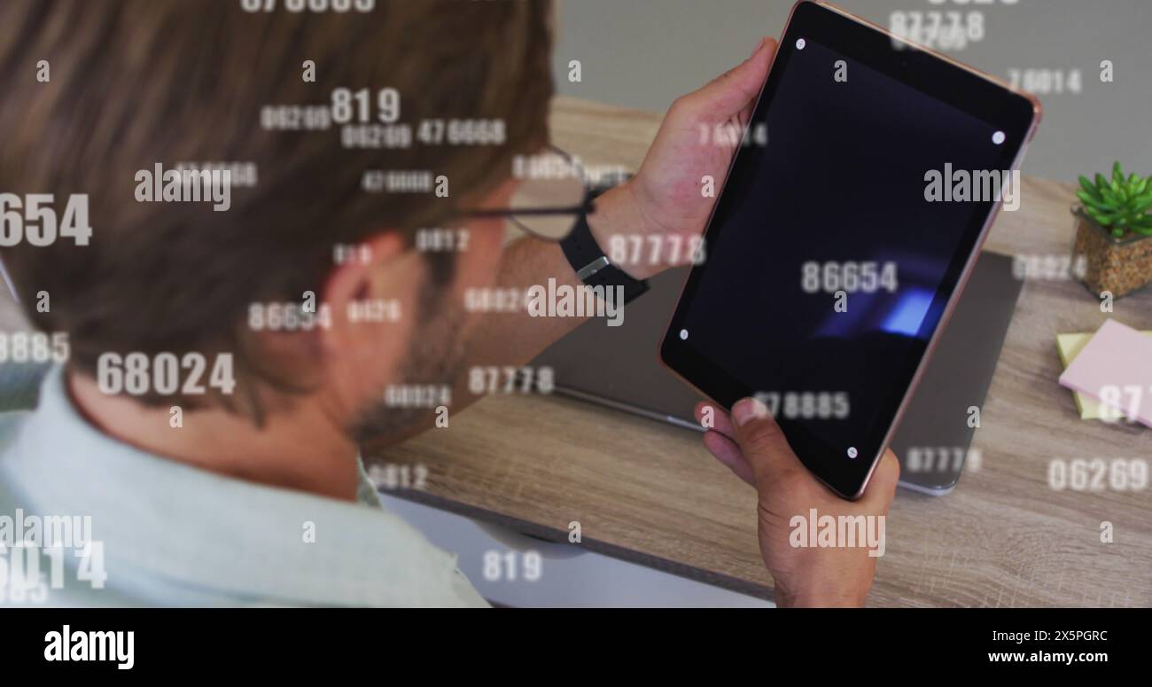 Image of data processing over caucasian man using tablet Stock Photo