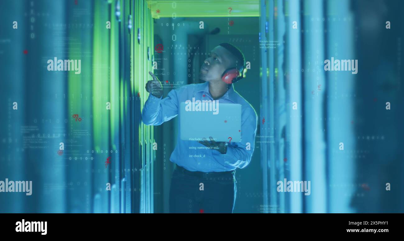 Image of computer language, binary codes, african american male engineer checking server racks Stock Photo