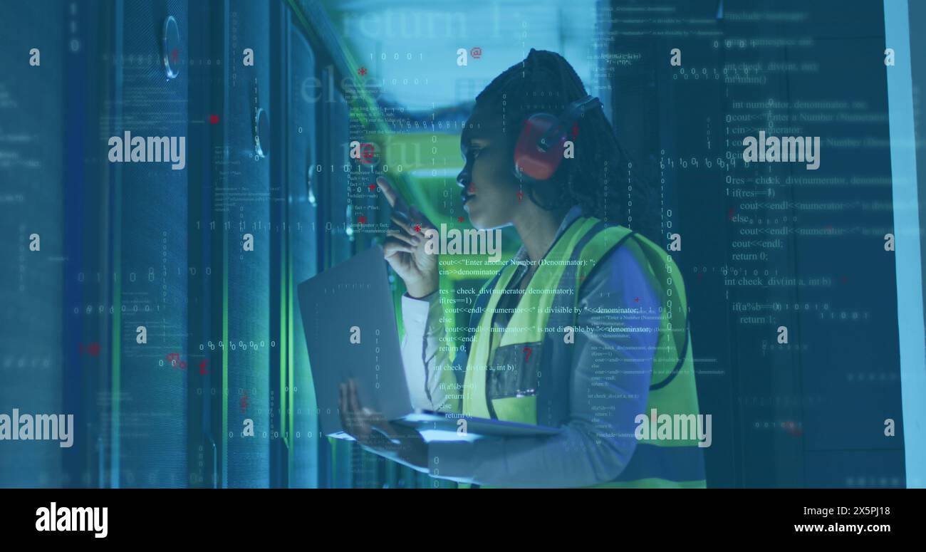 Image of computer language, african american female engineer checking server using laptop Stock Photo