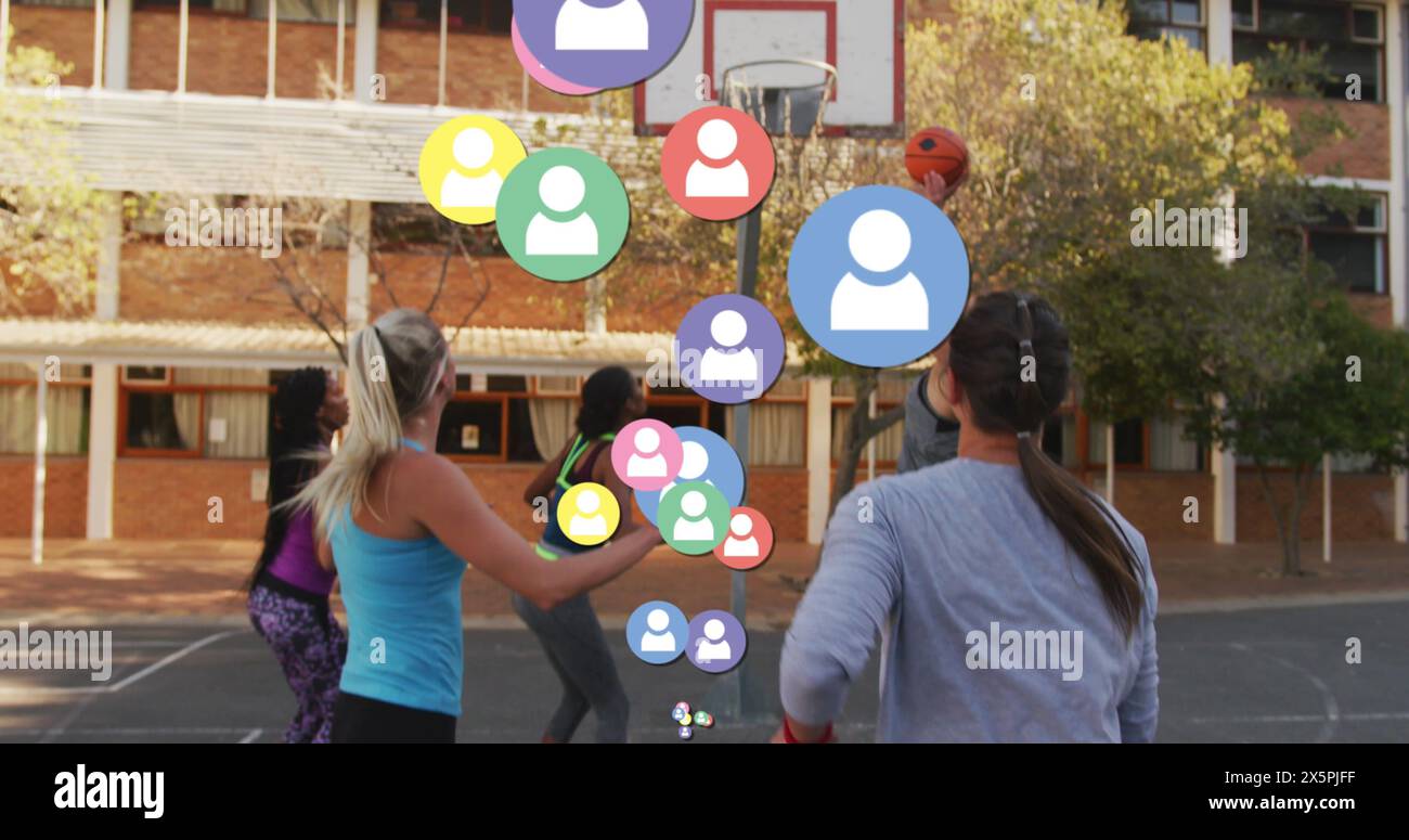 Image of social media icons over diverse basketball players Stock Photo