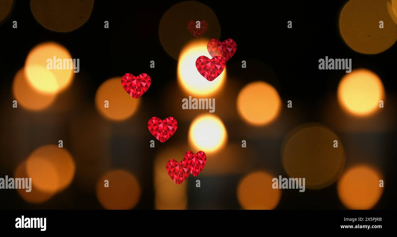Image of hearts over spots and candles Stock Photo