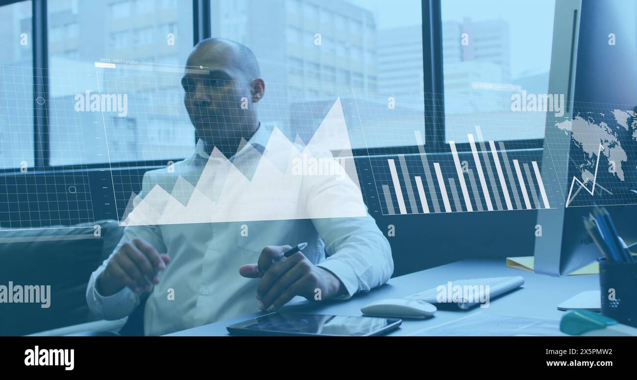 Image of statistical data processing against thoughtful biracial man at office Stock Photo