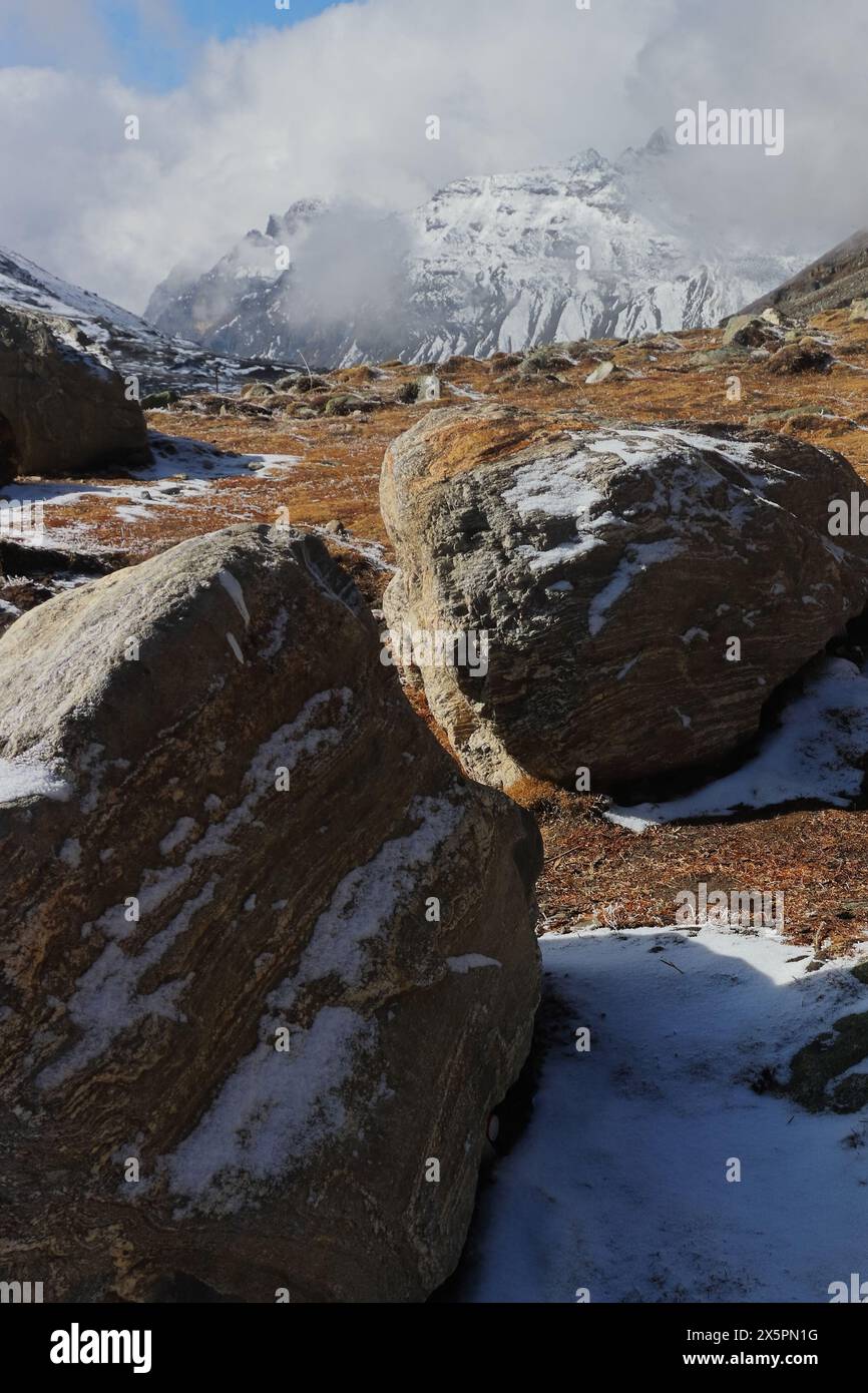 scenic landscape of alpine tundra valley and cloud covered snowcapped ...