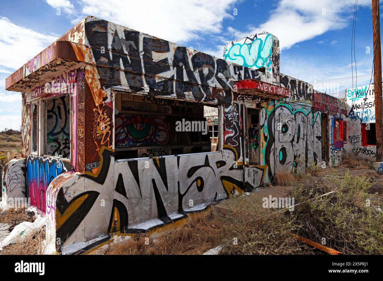 The graffiti covered diner at the Twin Arrows Trading Post sits along the old alignment of Route 66 east of Flagstaff, Arizona Stock Photo