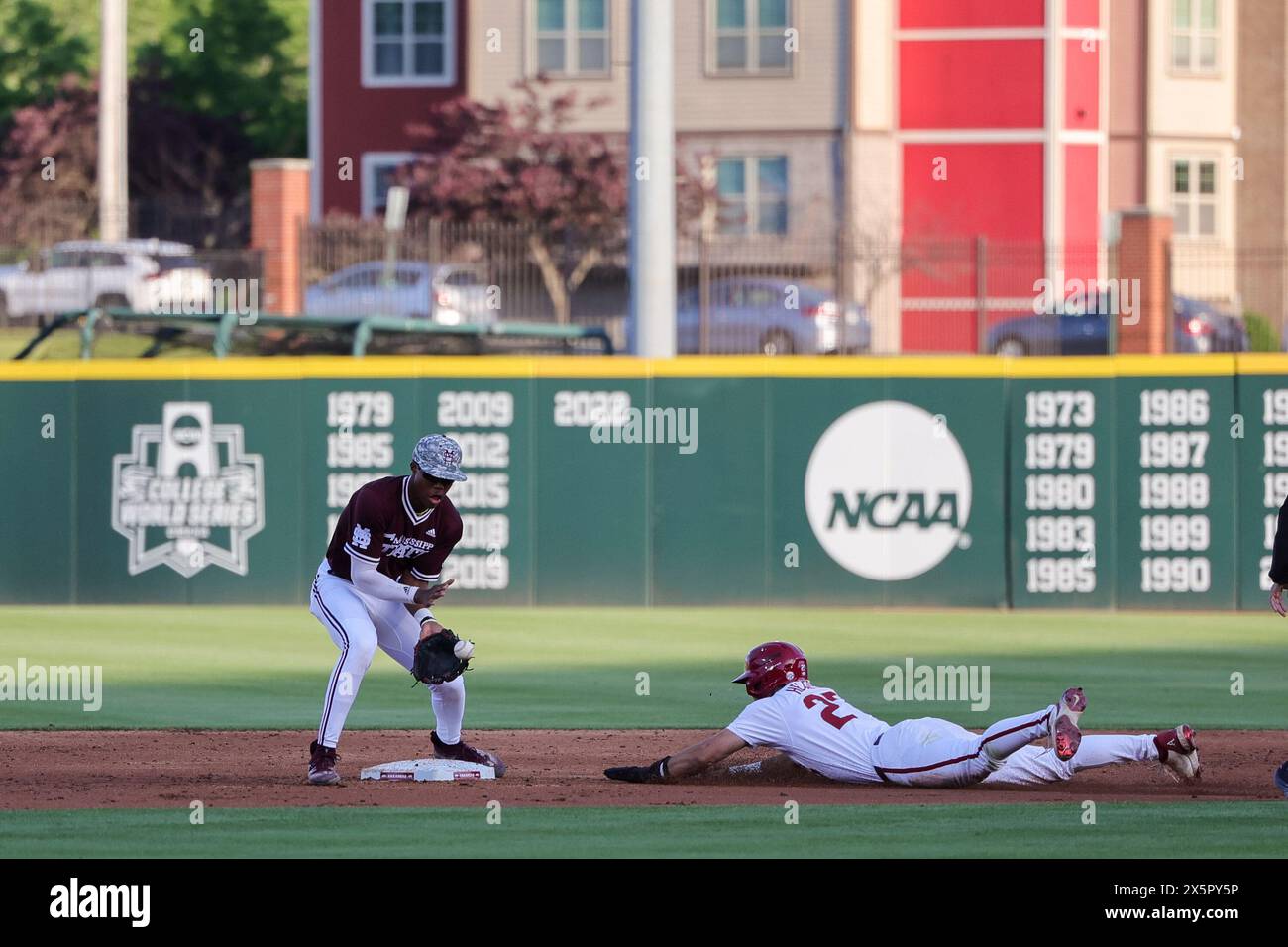 May 10, 2024: Ethan Pulliam #41 Mississippi State infielder looks in a ball thrown down to second as Ryder Helfrick #27 slides safely into second base head first. Arkansas defeated Mississippi State 7-5 in Fayetteville, AR. Richey Miller/CSM(Credit Image: © Richey Miller/Cal Sport Media) Stock Photo
