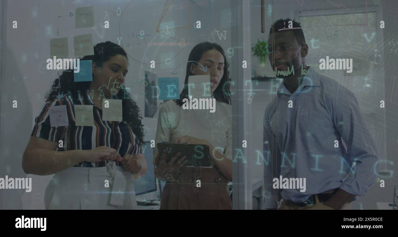 Diverse group of coworkers discussing over notes on glass Stock Photo