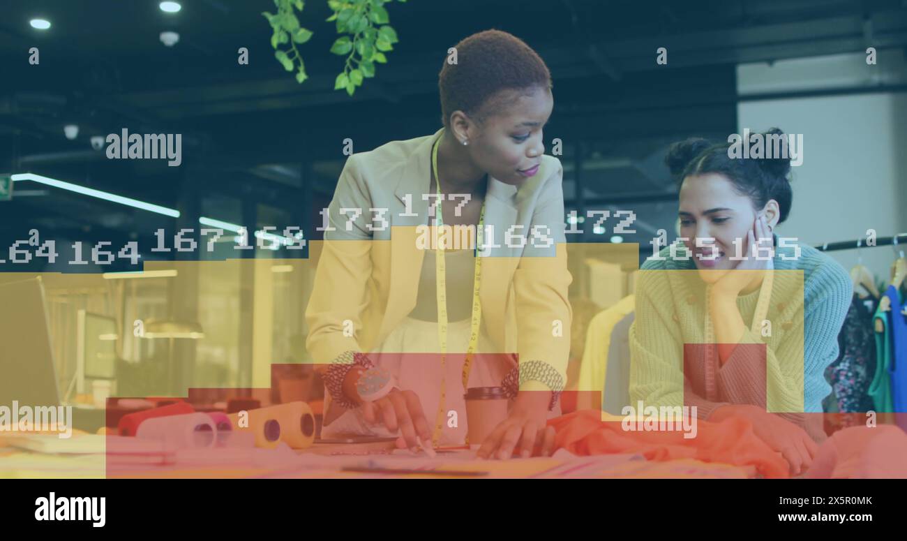 Image of statistical data processing over diverse female fashion designers discussing at studio Stock Photo