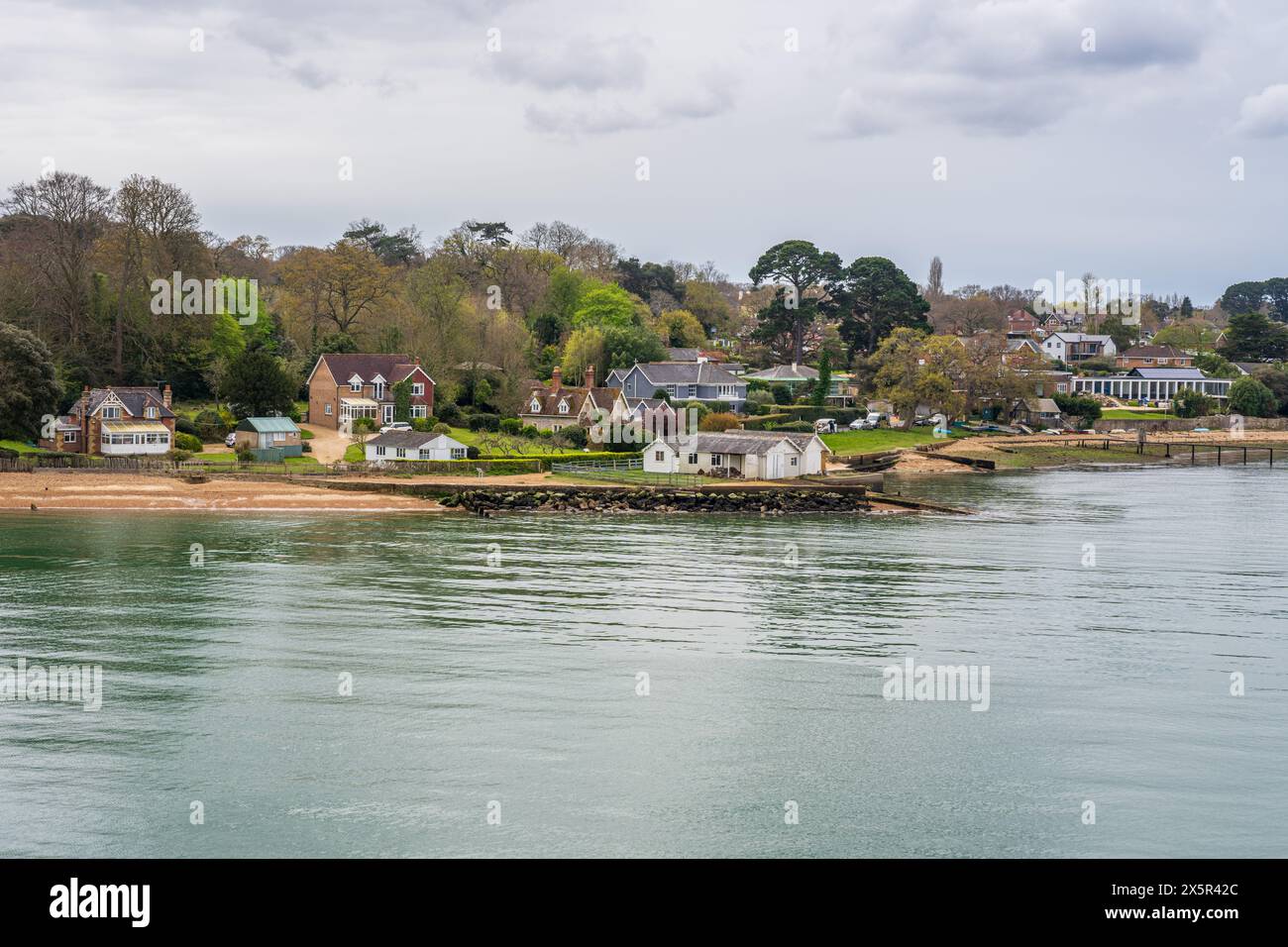 Fishbourne, Isle of Wight, England, UK - April 16, 2023: Houses on the banks of Wootton Creek Stock Photo