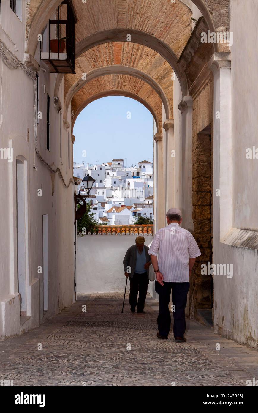 Senior citizens in the narrow streets of Vejer, Andalusia, Spain Stock Photo