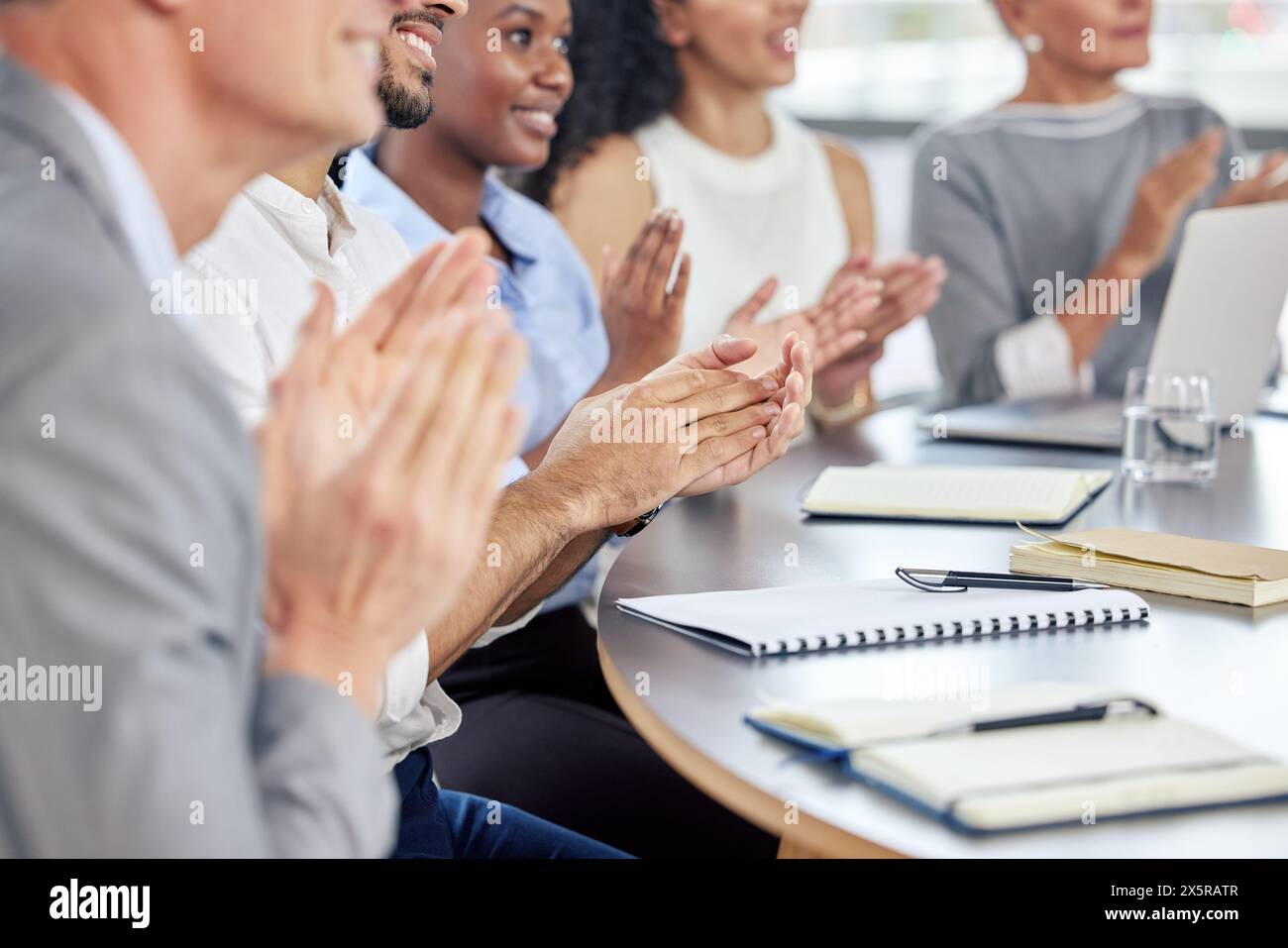 Male female trainees clapping hi-res stock photography and images - Alamy