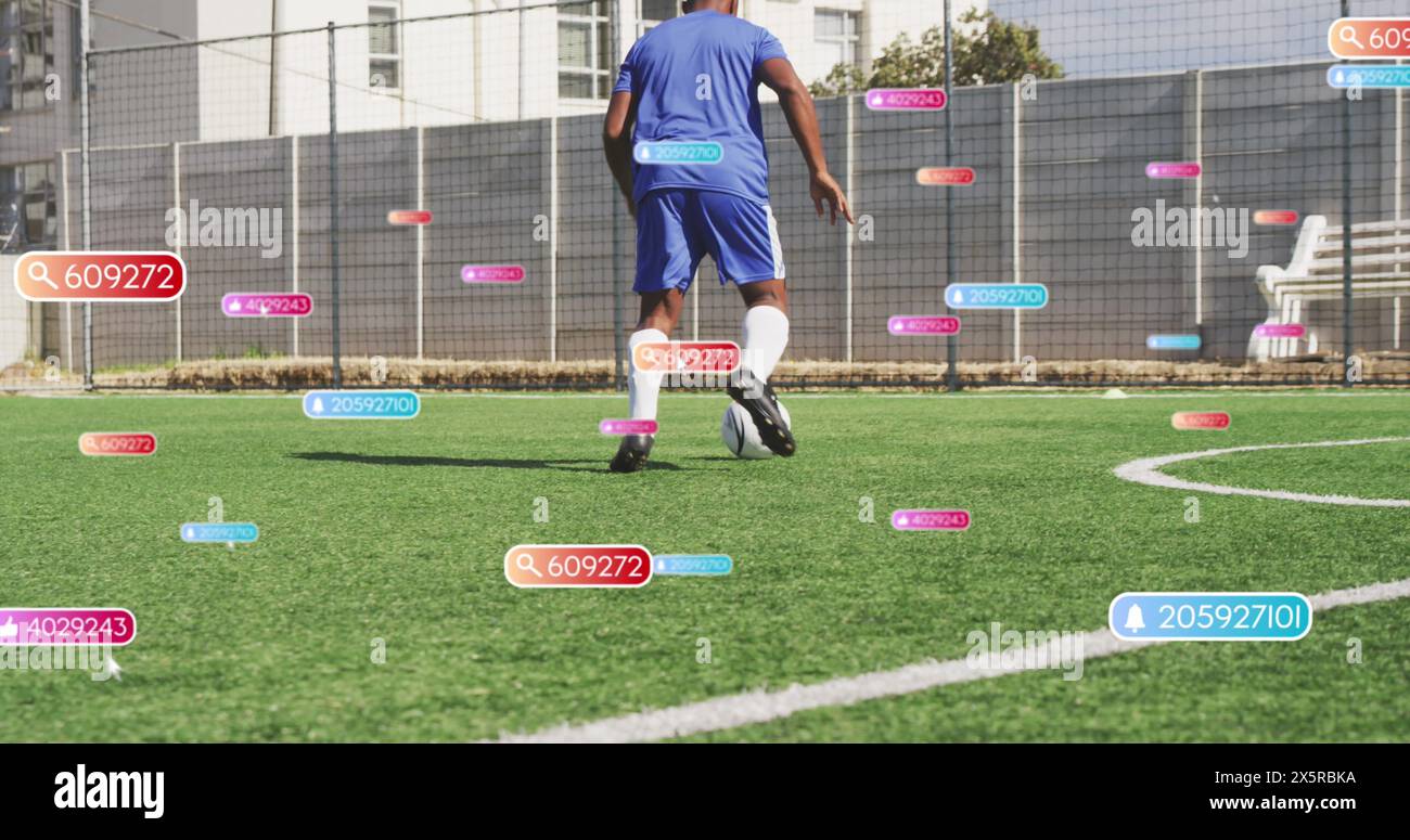 Social media concept icons against african american male soccer player practicing on sports field Stock Photo