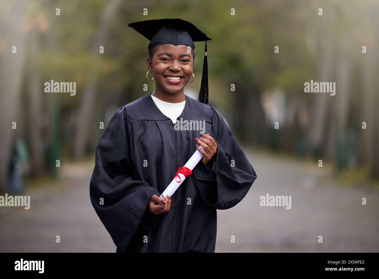 Black girl, portrait and diploma for graduation in outdoor, certificate ...