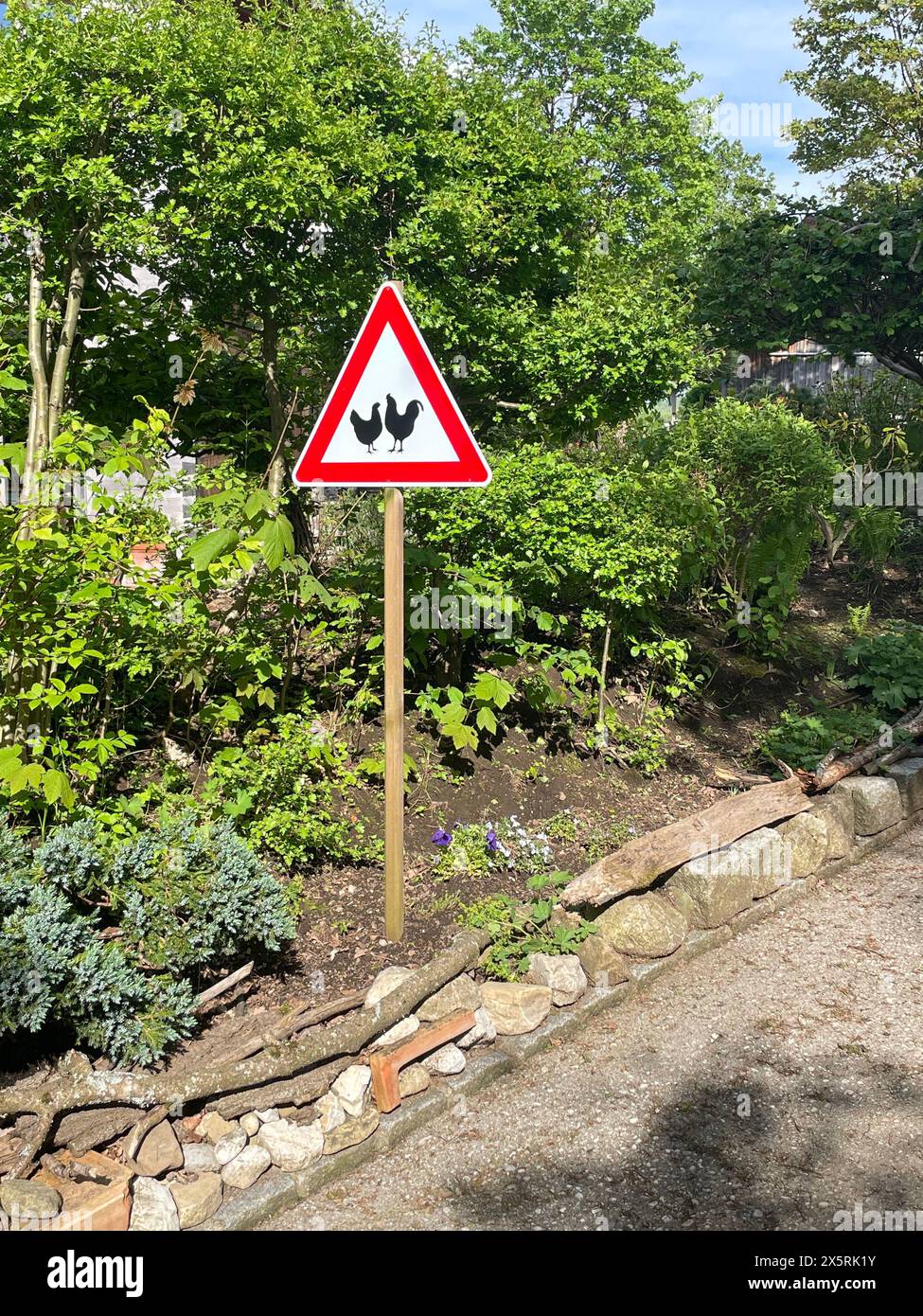 Roadside attention sign for free running chickens,  Bavaria, Germany. Photo by Willy Matheisl Stock Photo