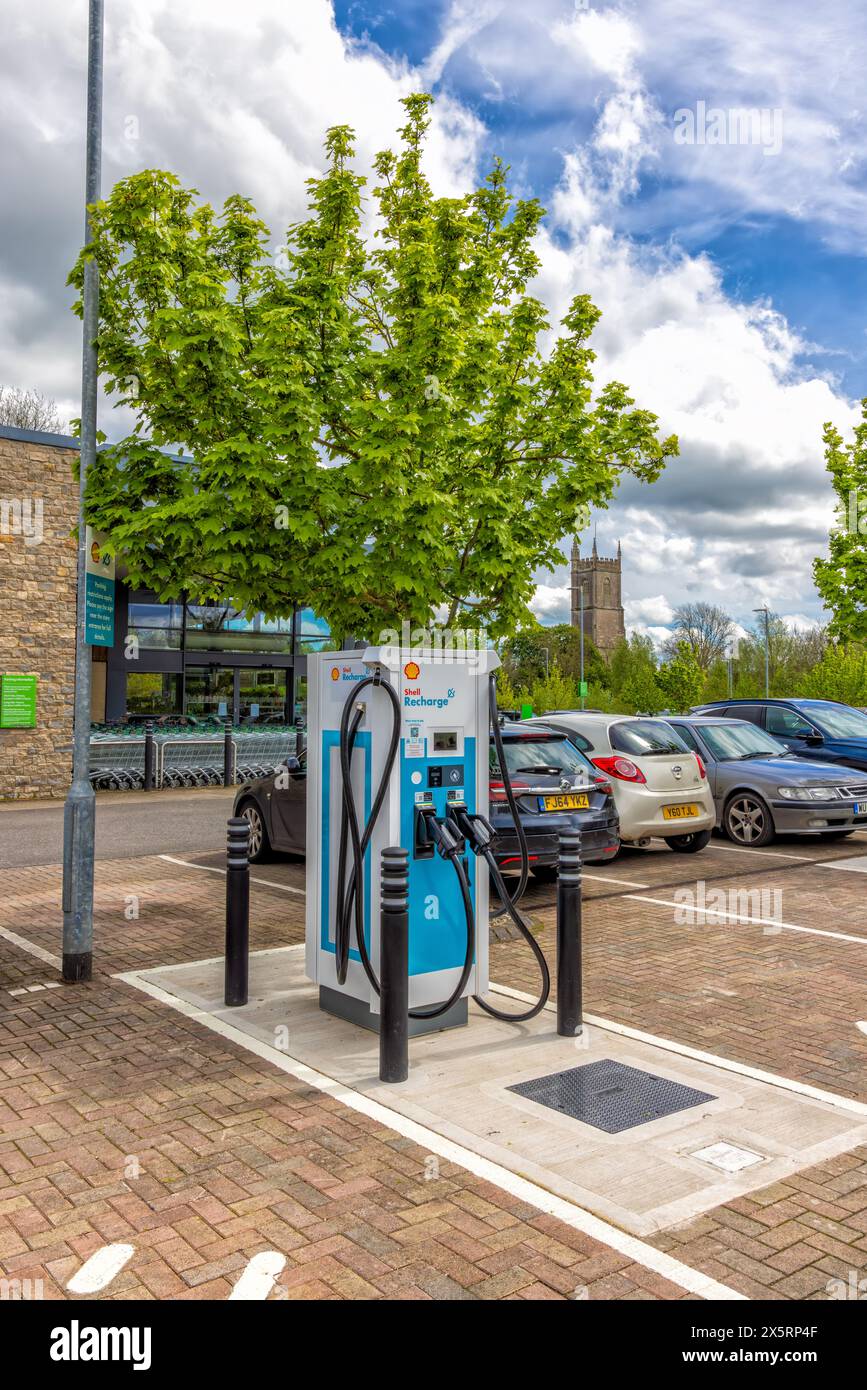 Public Electric Vehicle charging points in supermarket car park, Chipping Sodbury South Gloucestershire, United Kingdom Stock Photo