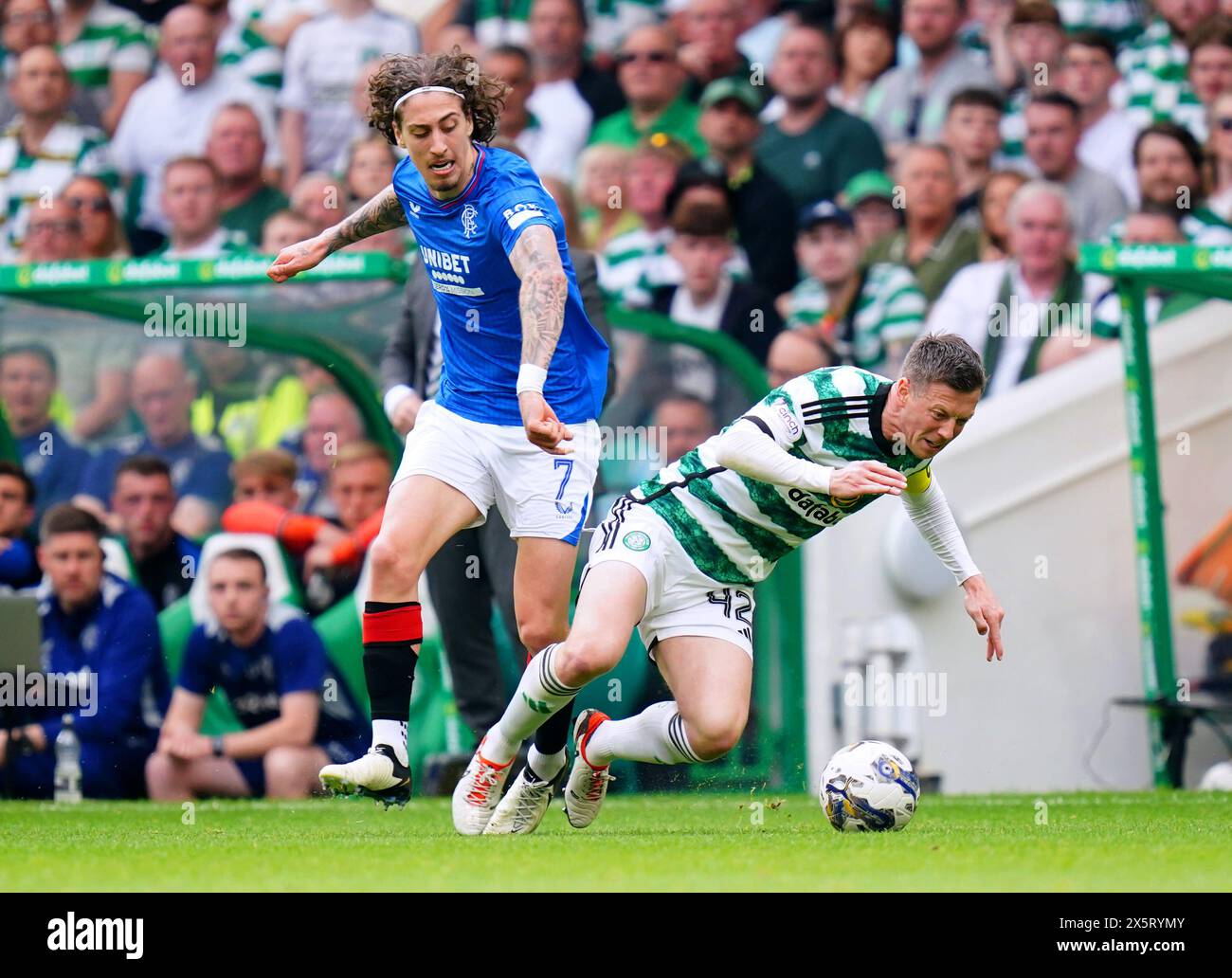 Celtic's Callum McGregor goes down whilst battling for the ball with Rangers' Fabio Silva during the cinch Premiership match at Celtic park, Glasgow. Picture date: Saturday May 11, 2024. Stock Photo