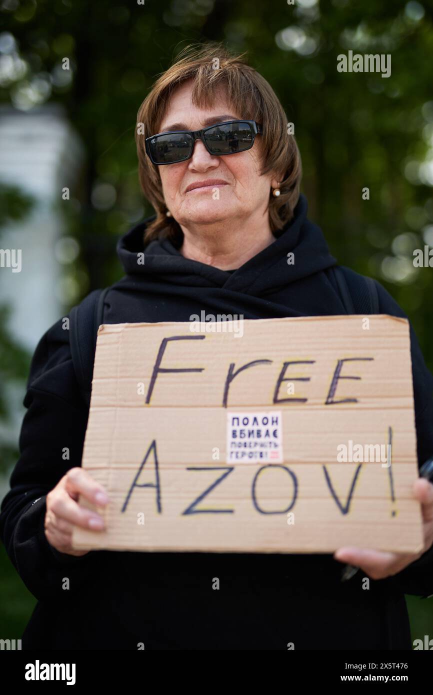 Senior Ukrainian lady demonstrating with a sign 