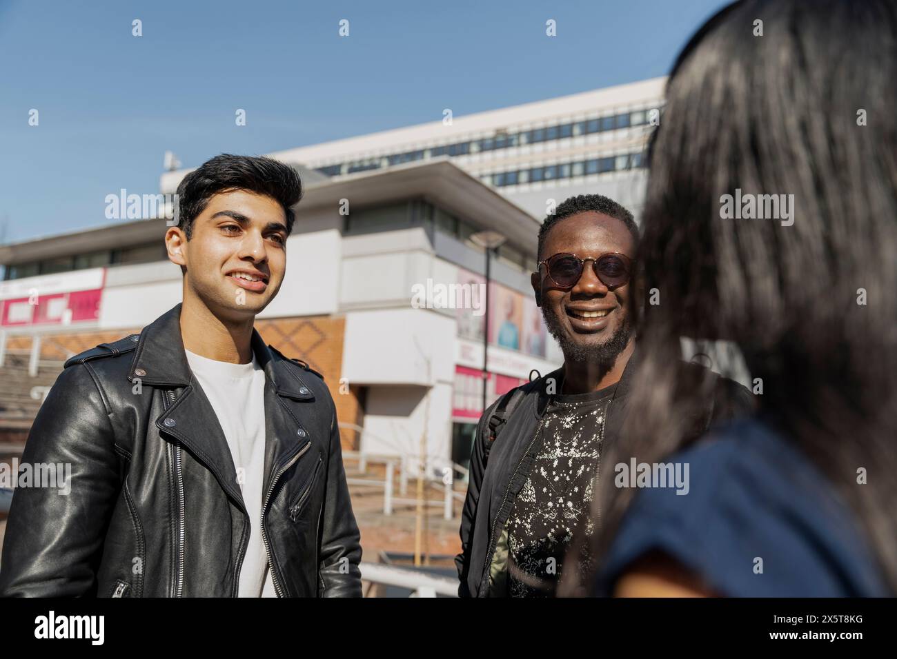 Group of student friends talking on campus Stock Photo