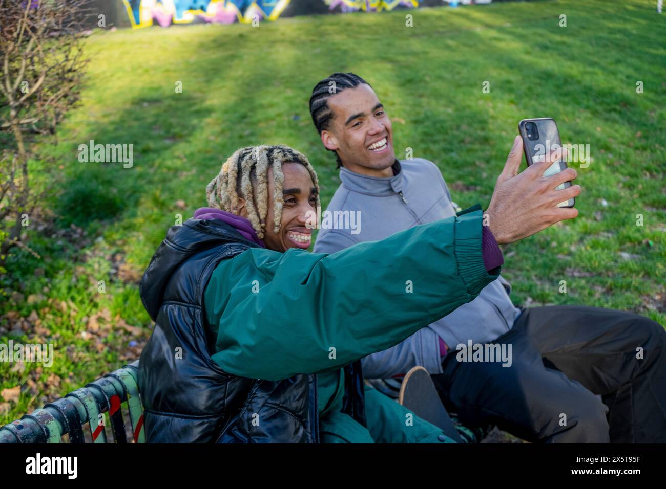 Young male friends taking selfie outdoors Stock Photo