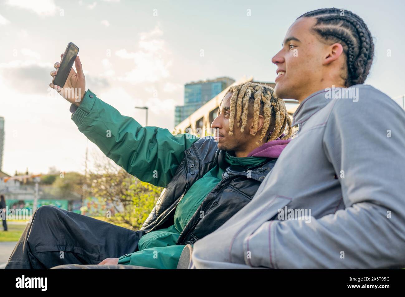 Young male friends taking selfie outdoors Stock Photo