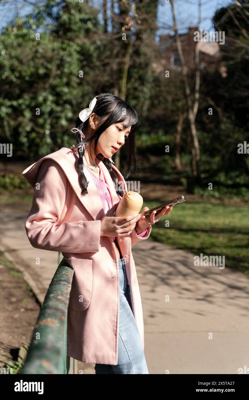 Woman in park using hi-res stock photography and images - Alamy