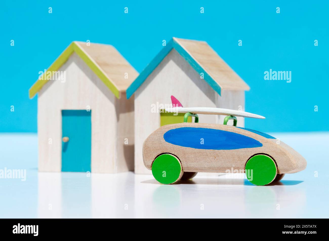 Model beach huts and car with surfboard Stock Photo