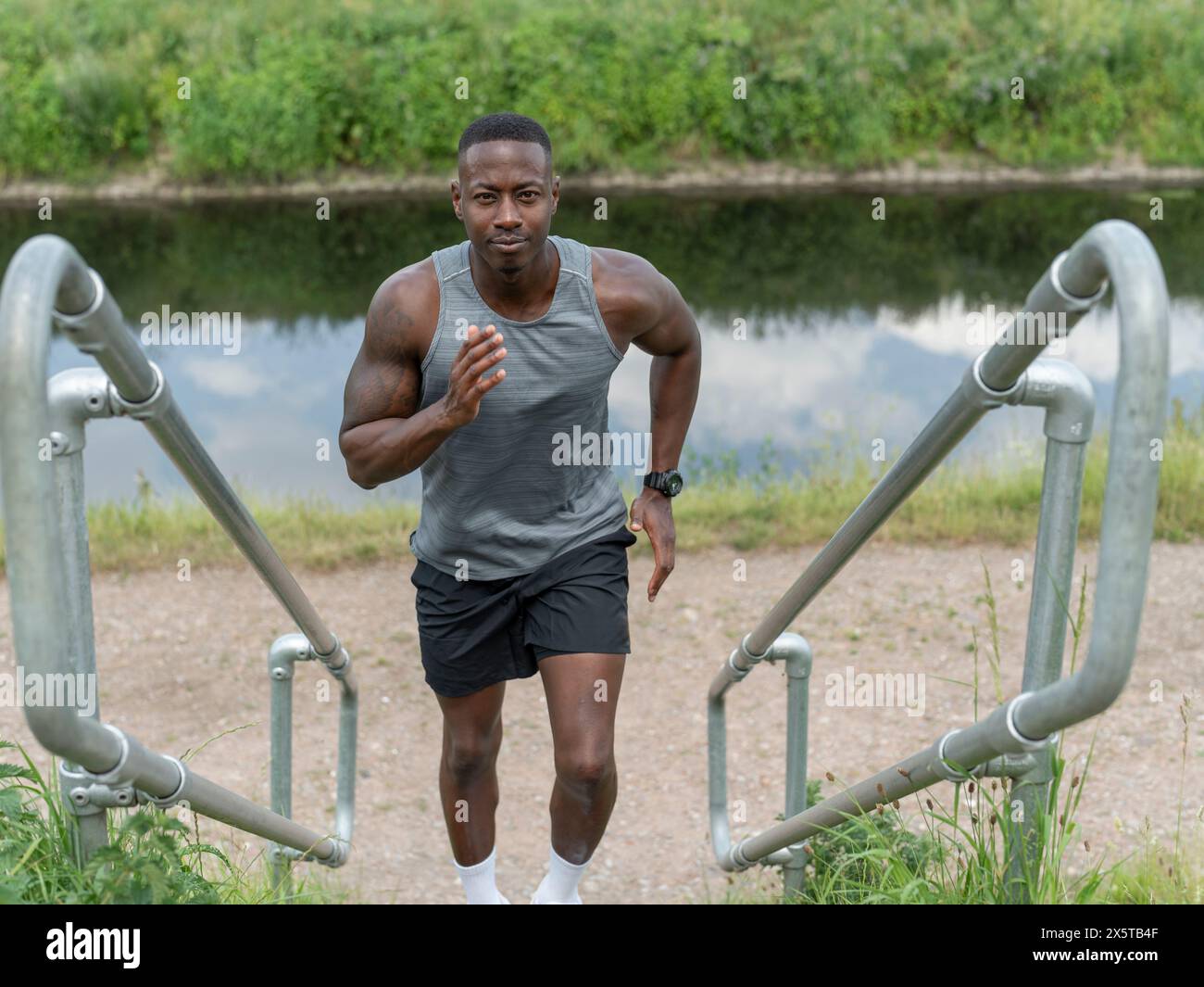 Black man running up stairs hi-res stock photography and images - Alamy
