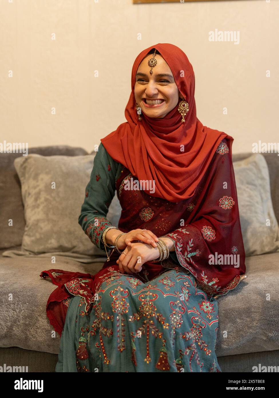 Woman wearing hijab sitting home hi-res stock photography and images ...
