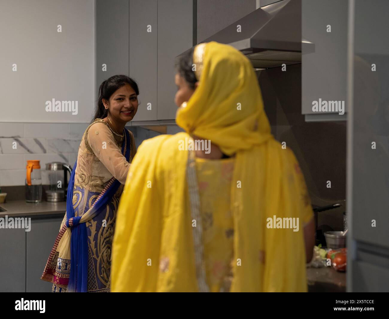 Women in traditional clothing cooking meal together Stock Photo Alamy