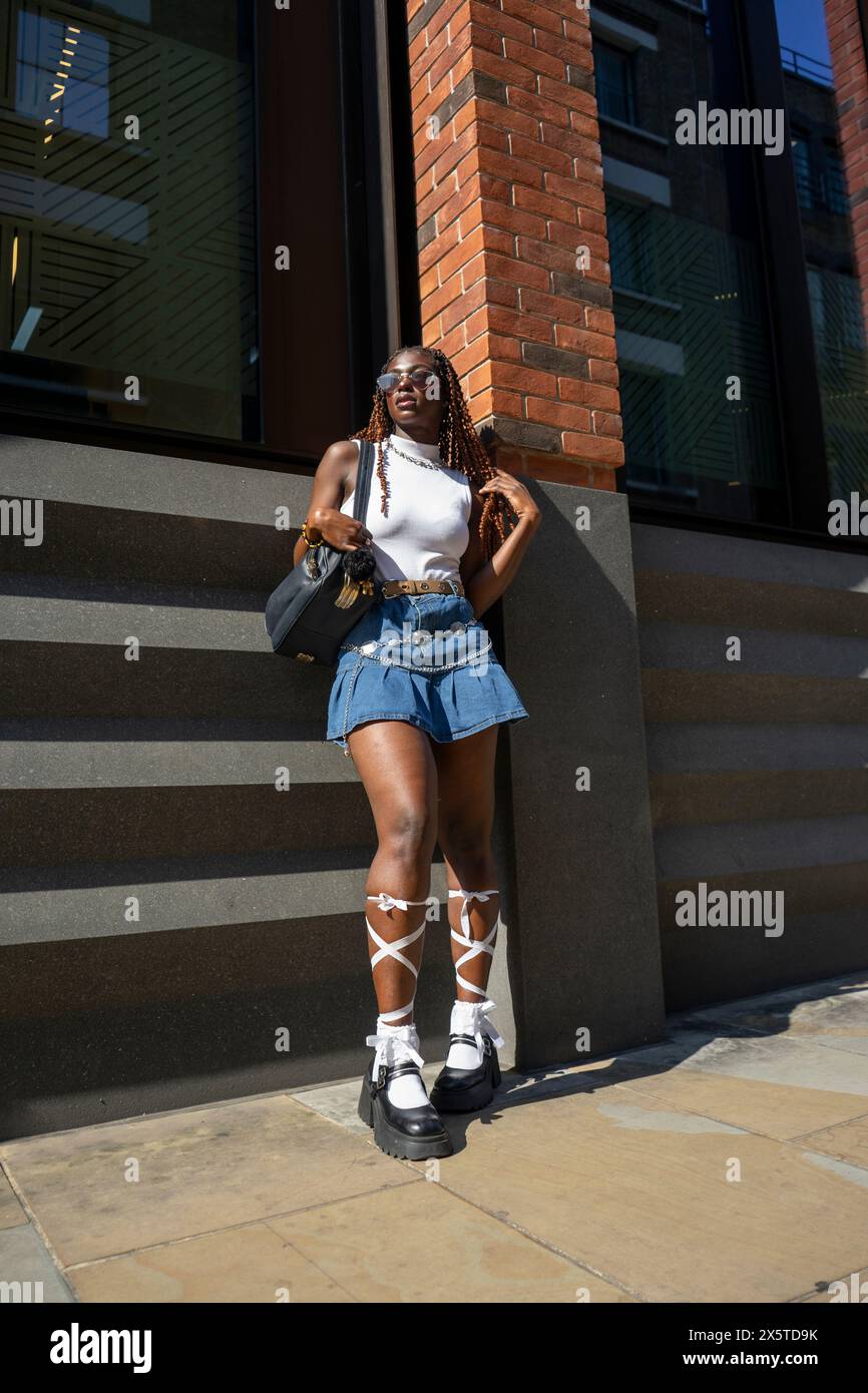 Woman wearing mini skirt hi-res stock photography and images - Alamy