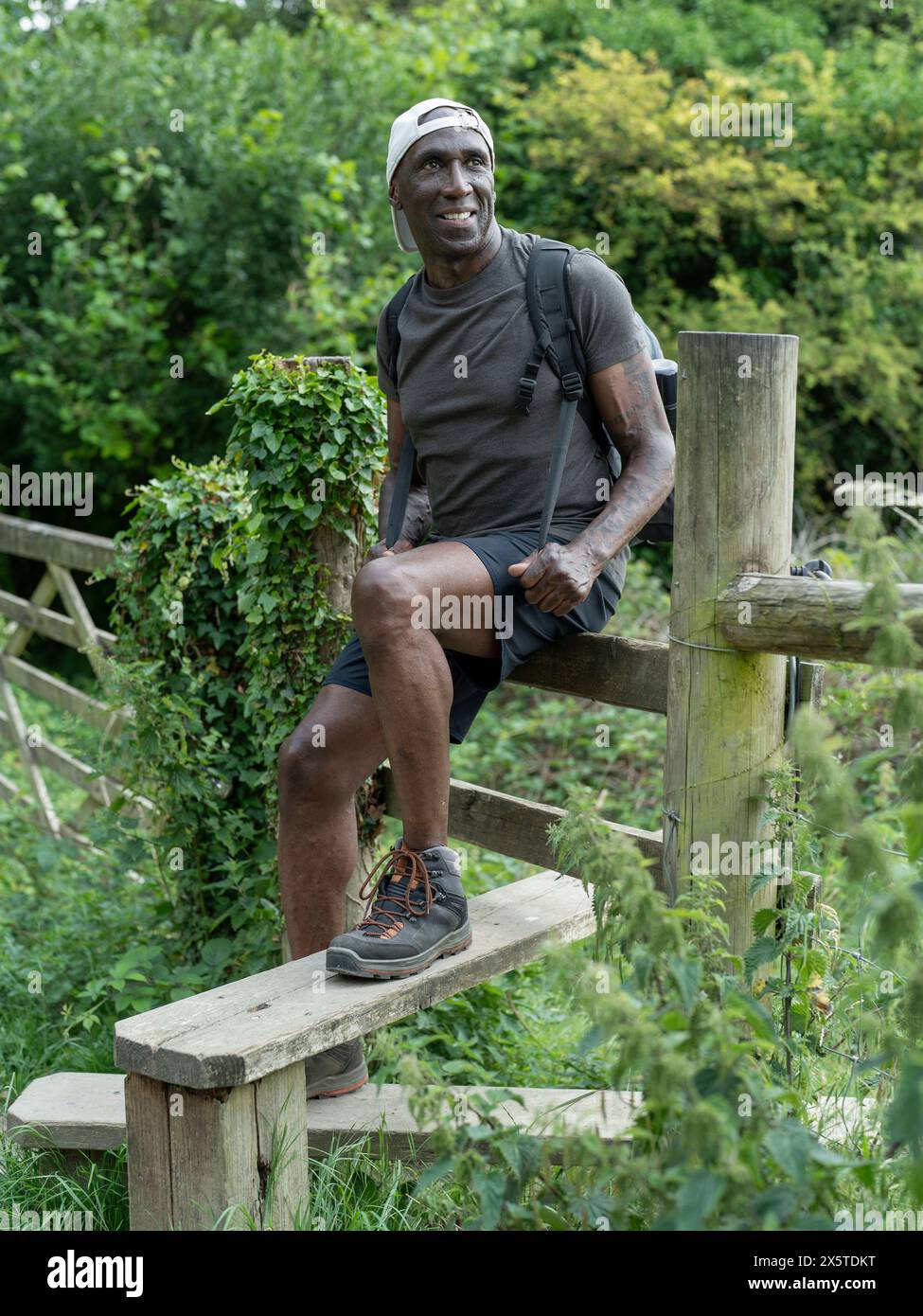 Man sitting fence hi-res stock photography and images - Alamy