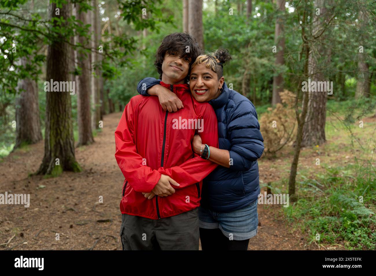 Portrait of mother and son hiking in forest Stock Photo