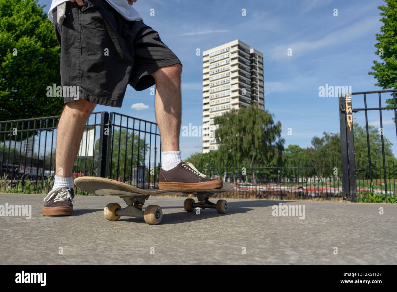 Young man skateboarding in skate park Stock Photo