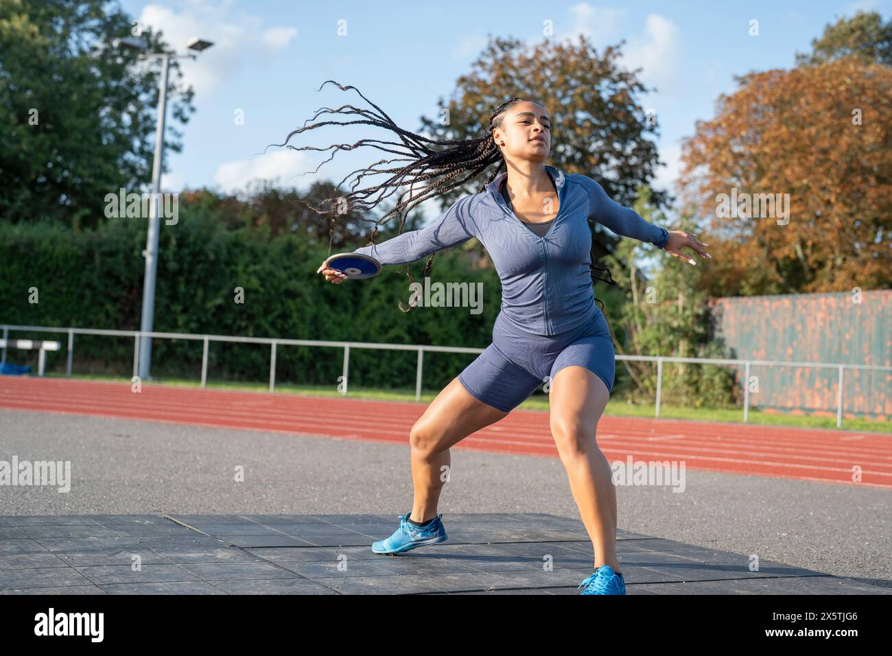 Female athlete training discus throwing at stadium Stock Photo Alamy