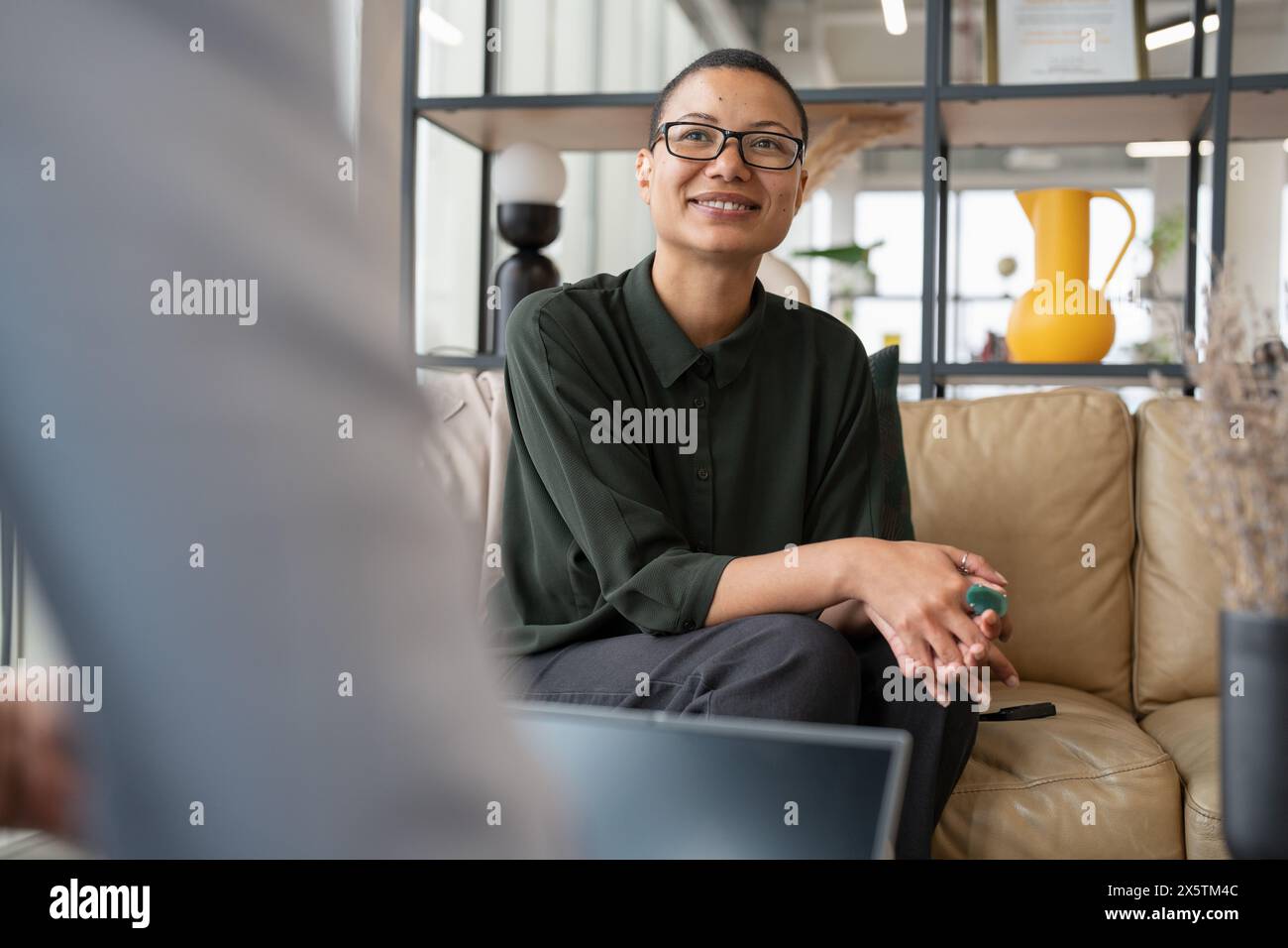 Business people having meeting in office lobby Stock Photo - Alamy