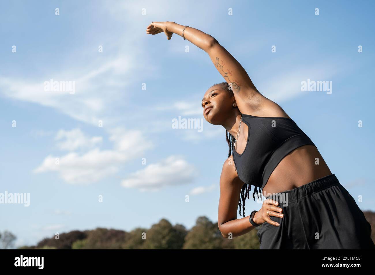 Active woman stretching in hi-res stock photography and images - Alamy