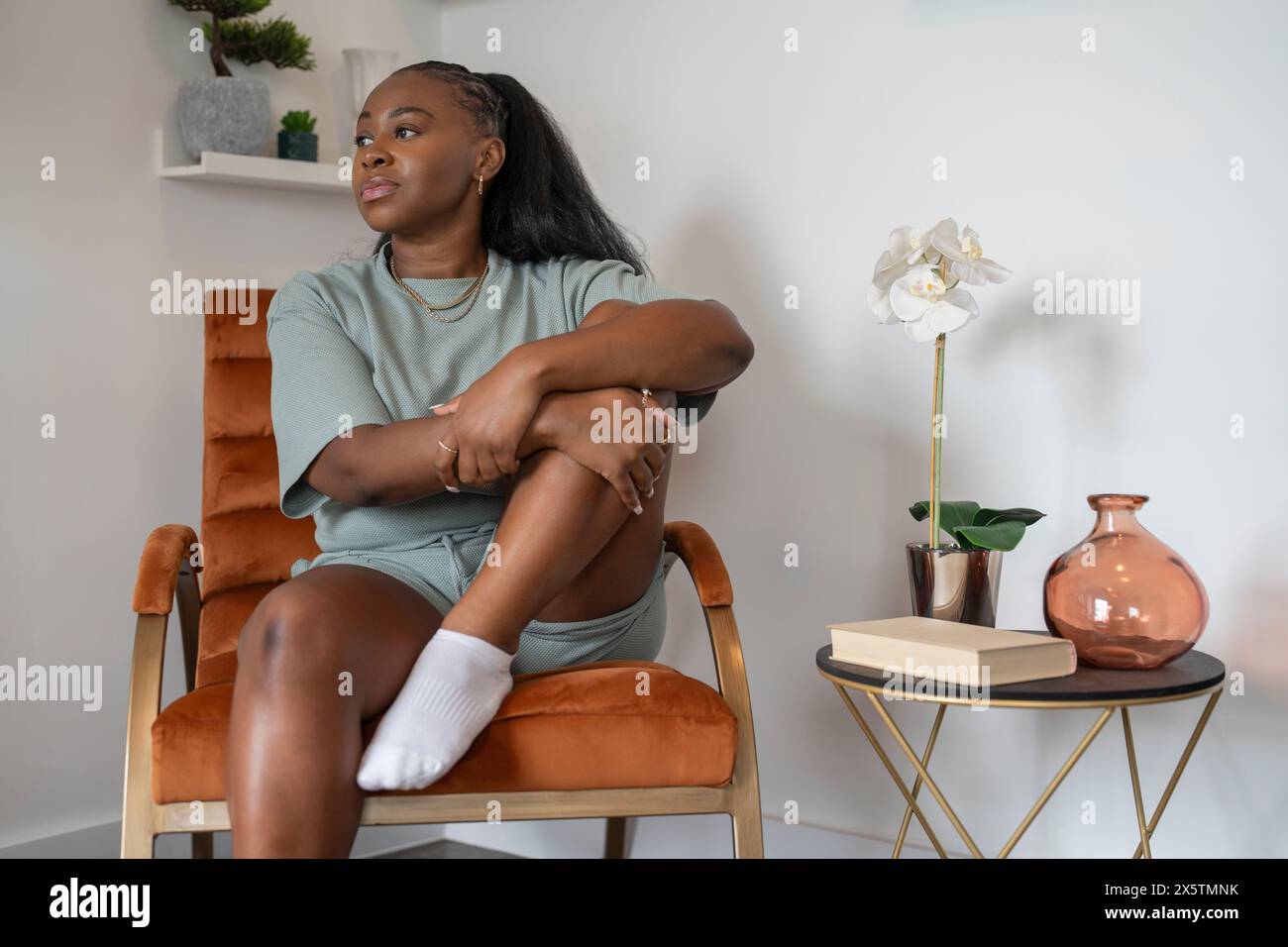 African woman side view sitting hi-res stock photography and images - Alamy
