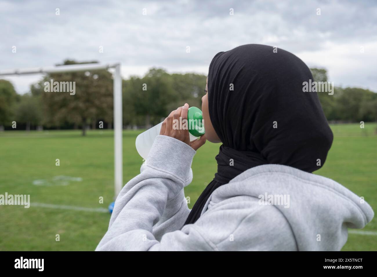 Woman in hijab holding soccer hi-res stock photography and images - Alamy