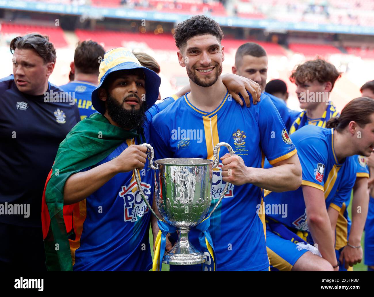 Romford's Hassan Nalbant (right) celebrates with their teammate after