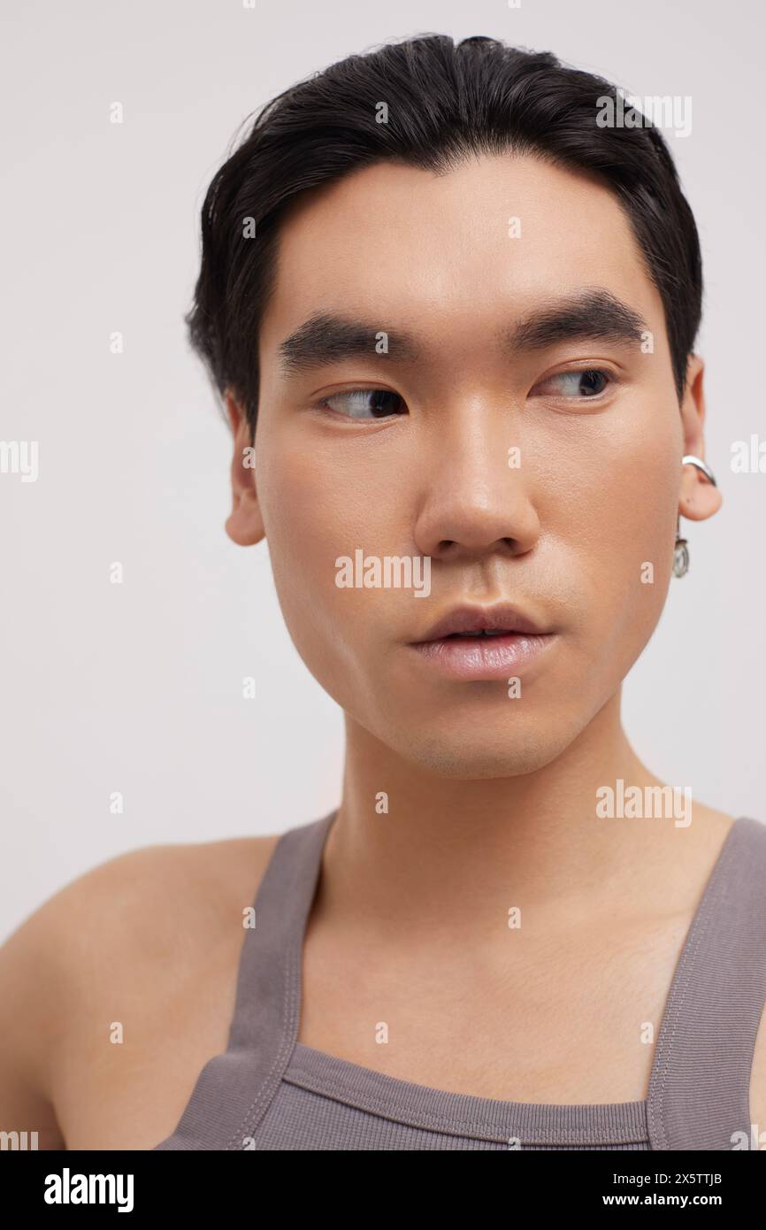 Studio portrait of handsome man with ear piercing Stock Photo