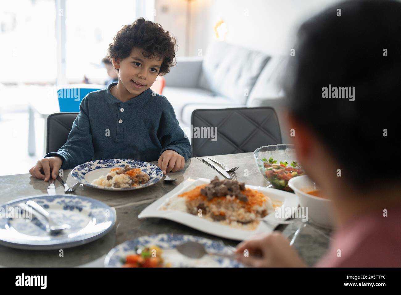 Mother boy dining table hi-res stock photography and images - Alamy