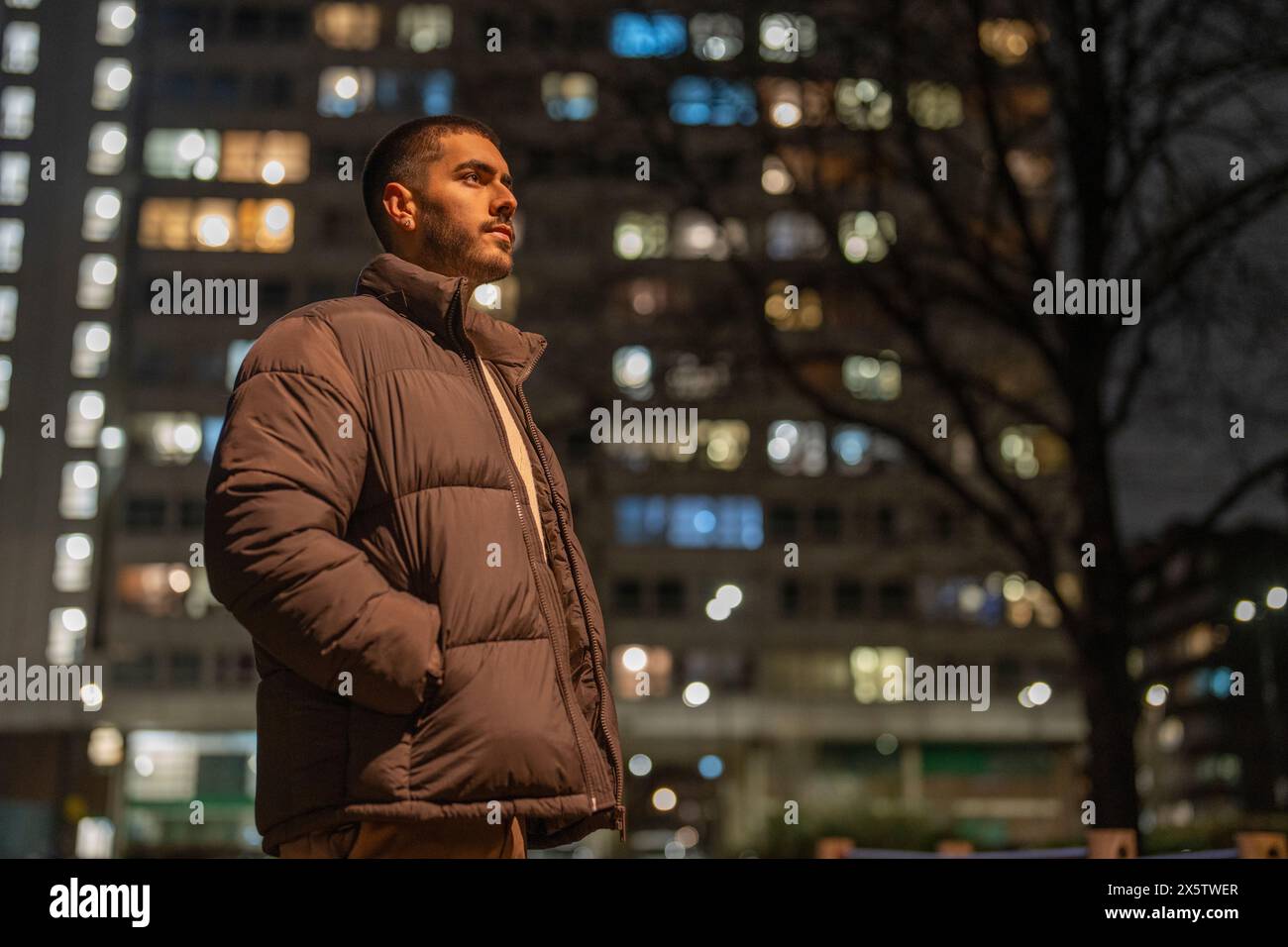 Young hispanic man outdoors city hi-res stock photography and images ...